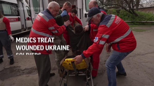 Medics treat wounded Ukraine soldiers