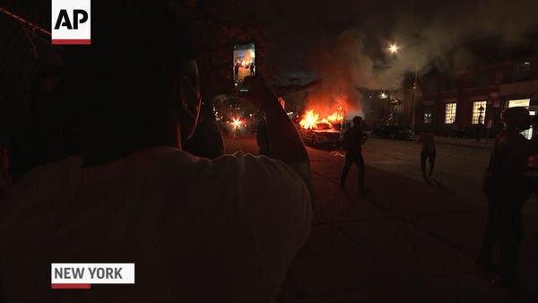 New York protesters set fires, clash with police