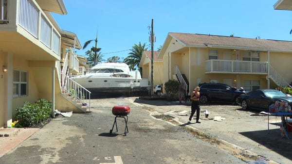 Ian washes boats into Fort Myers apartment complex