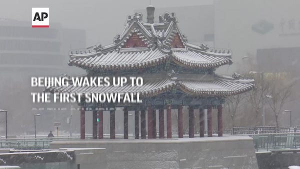 Beijing wakes up to the first snowfall of the Olym