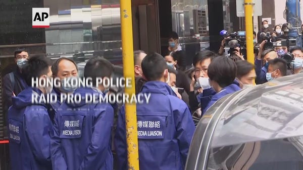 HK police raid pro-democracy news outlet