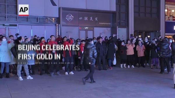 Beijing celebrates first gold in Winter Olympics