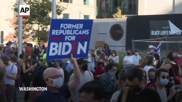 Biden supporters celebrate win as rivals protest