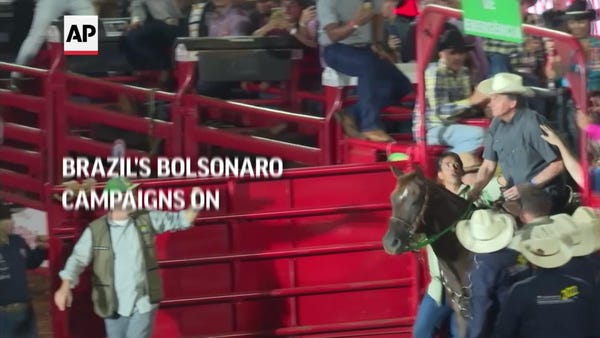 Brazil's Bolsonaro campaigns on horseback at rodeo