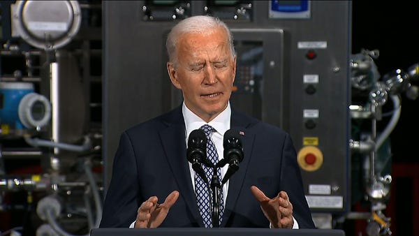 At vaccine plant, Biden hopes for year end normalc
