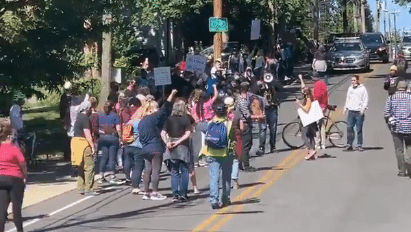 Demonstrators protest outside McConnell's home