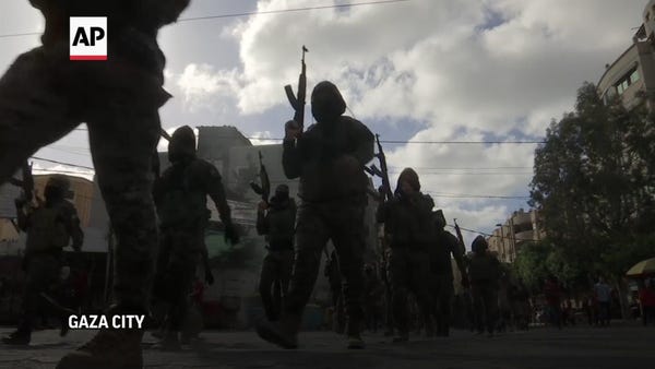 Hamas militants celebrate ceasefire in Gaza