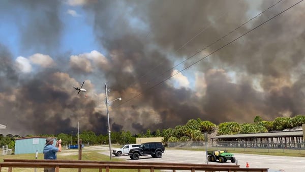 Florida wildfire grows to 10 times its size in les