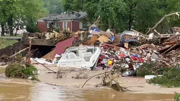 Damage, debris and fires left after deadly floodin