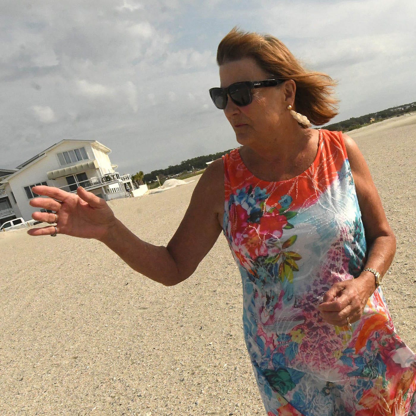 Glenda Browning talking on the beach.