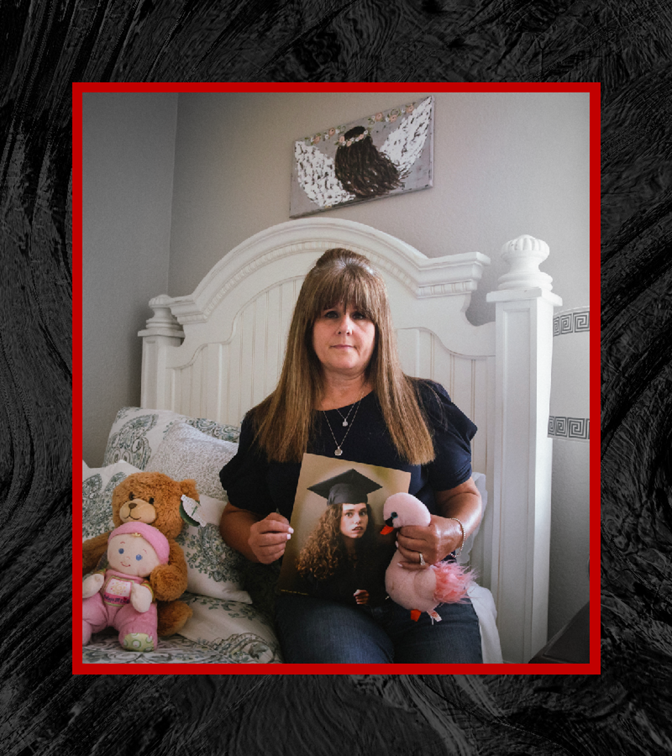 Joann Pierson poses sitting on a bed next to a handful of stuffed animals, holding a photo of her daughter, 36-year-old Kristi Norris, who died at a D&S Residential Services Group home in October 2020. The photo is desaturated except for the mother and her mementos. In the photo she holds, Kristi is sporting her grad cap and robes. A border of dark water surrounds the photograph.