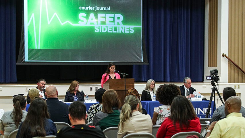 Courier Journal reporter Stephanie Kuzydym emcees a panel on safety in youth sports