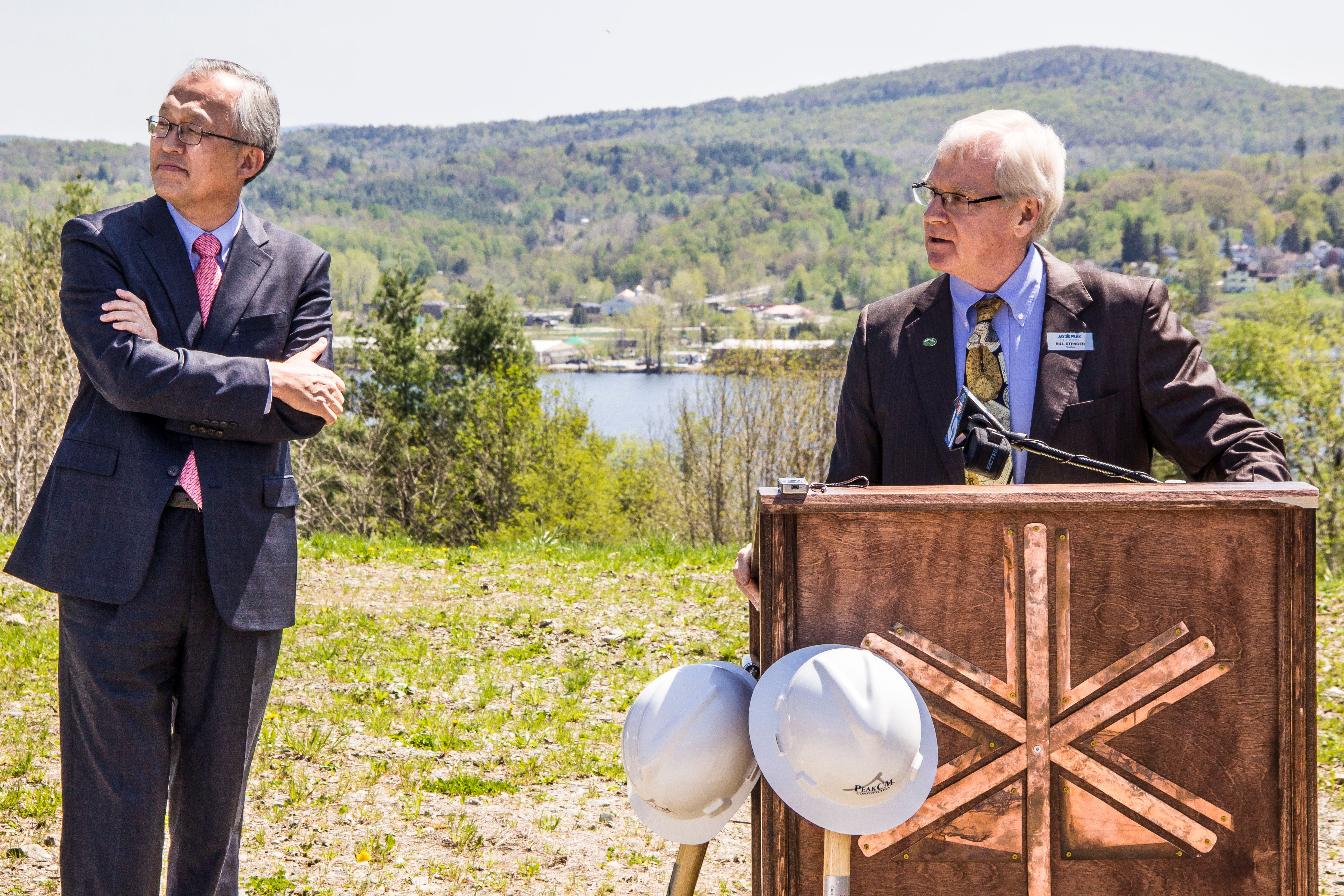 Bill Stenger, at podium, and Dr. Ike Lee, AnC Bio CEO, at the groundbreaking ceremony for the new biotech facility in Newport. The project was caught up in an alleged fraud and never got underway.