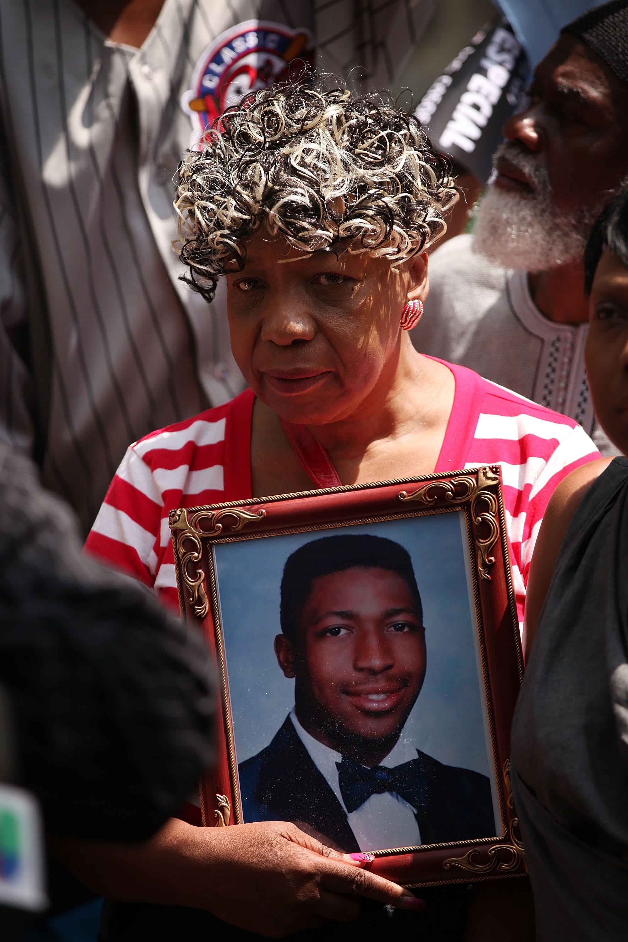 Gwen Carr, the mother of Eric Garner, holds a picture of her son at a rally in New York on July 7, 2015.