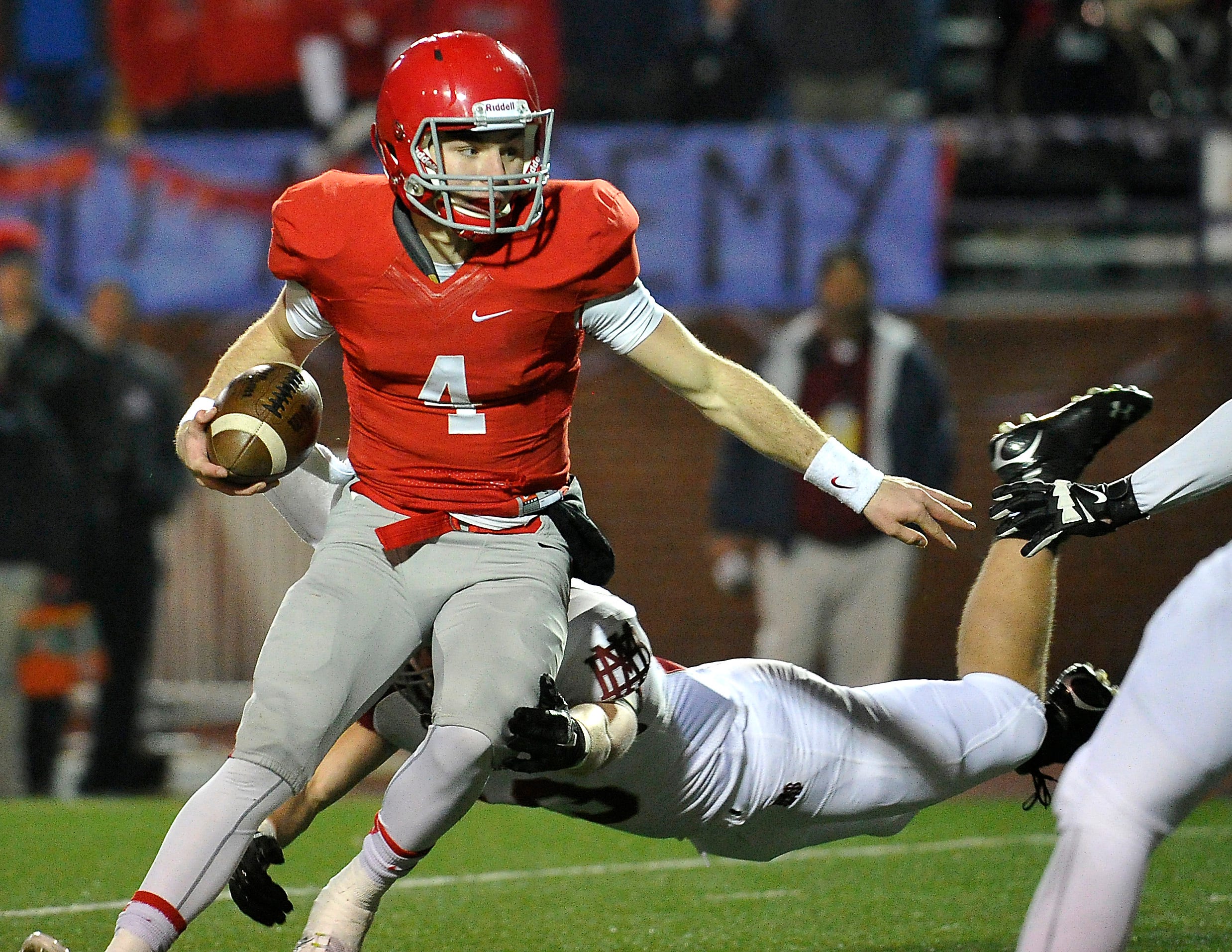 Brentwood Academy's Jeremiah Oatsvall scrambles in the DII-AA state title game. Oatsvall was named offensive MVP, completing 17 of 29 pass attempts for 280 yards and gaining 159 yards rushing and two scores on 23 carries.