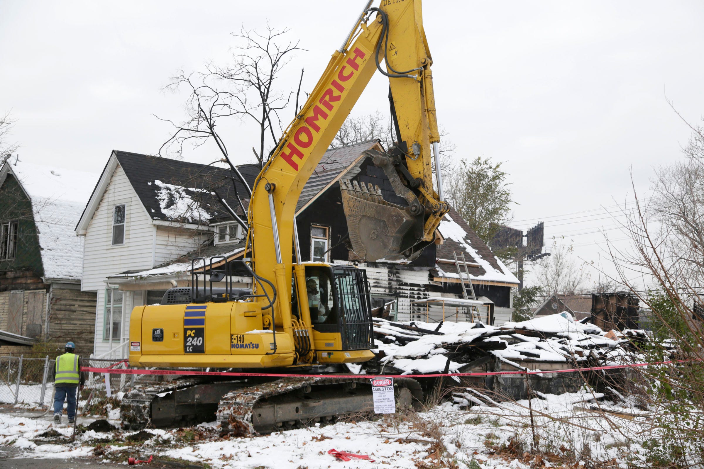 The demolition of a house on Lyon Street in southwest Detroit in 2015.