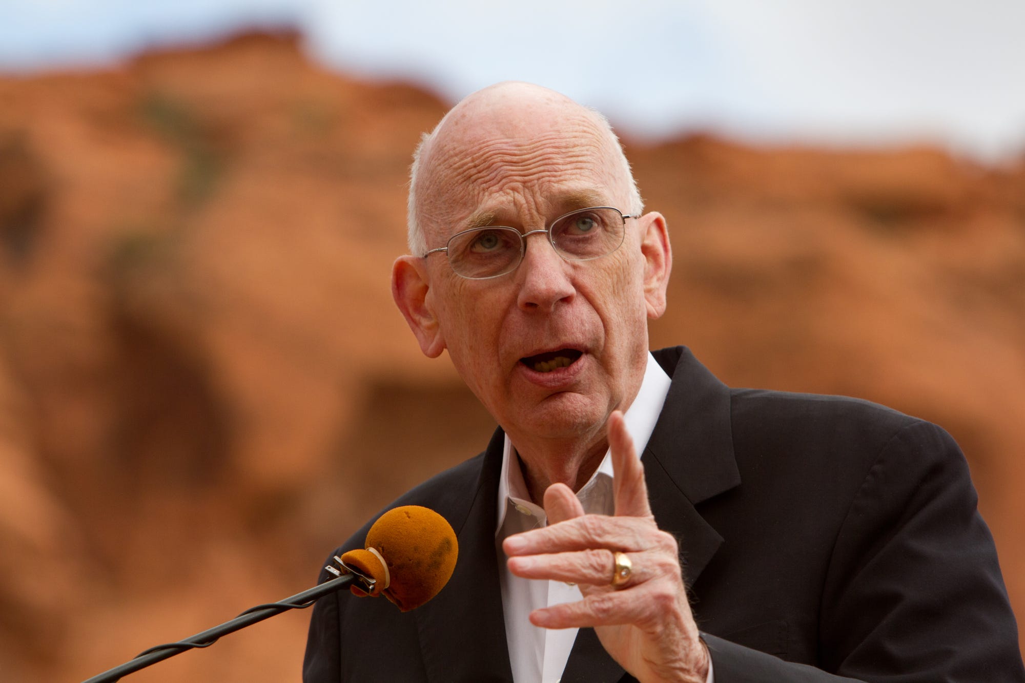 In this May 7, 2012, file photo, former U.S. Sen. Bob Bennett addresses the crowd gathered at the Tuacahn Center for the Arts on the borders of Snow Canyon State Park and the Red Cliffs National Conservation Area during the dedication ceremony for the Red Cliffs and Beaver Dam Wash National Conservation Areas in Ivins.