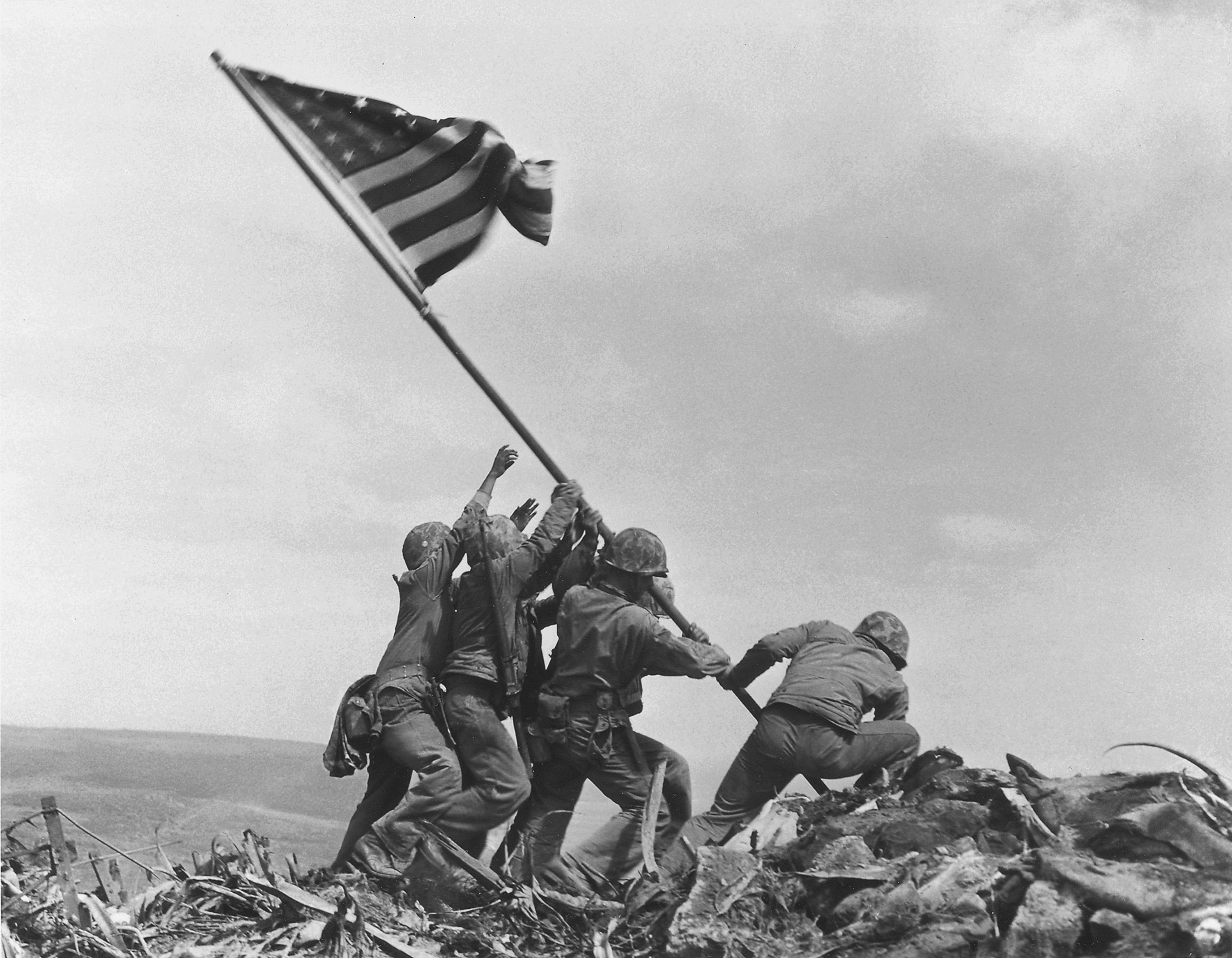 In this Feb 23, 1945, file photo, U.S. Marines of the 28th Regiment, 5th Division, raise the American flag atop Mount Suribachi, Iwo Jima, Japan.