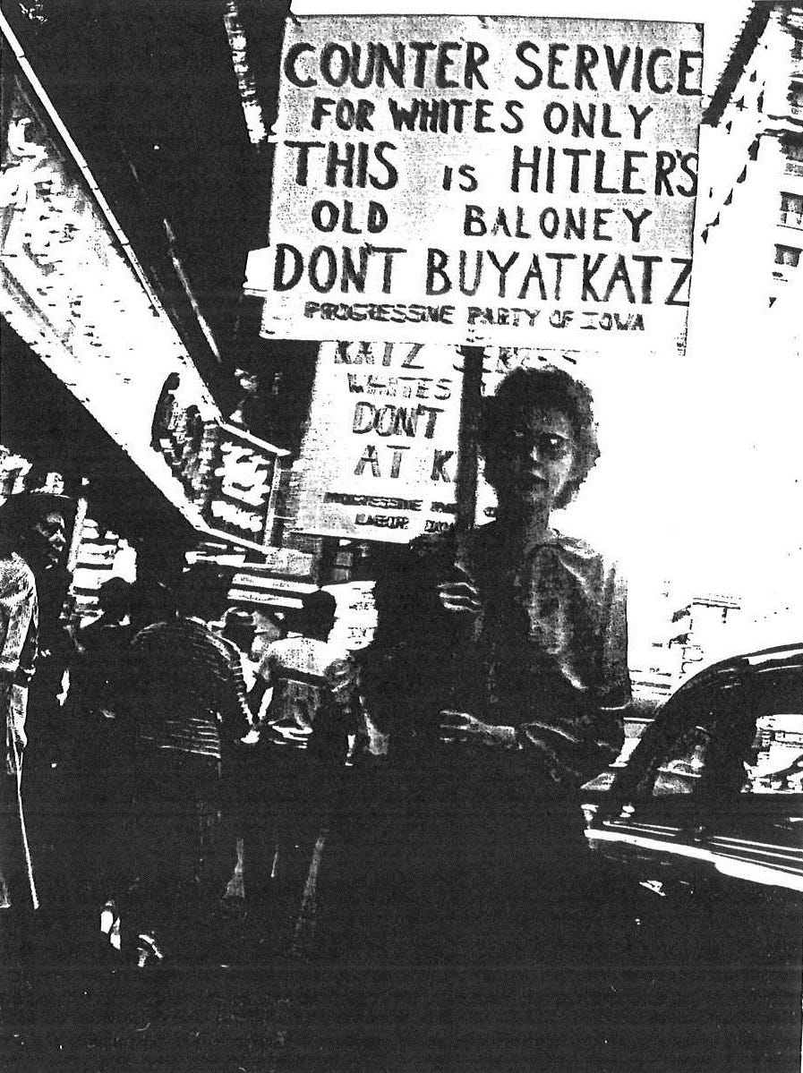 Civil rights activists picket outside Katz Drug Store in downtown Des Moines, where in 1948 Edna Griffin was refused service at the lunch counter because she was black.