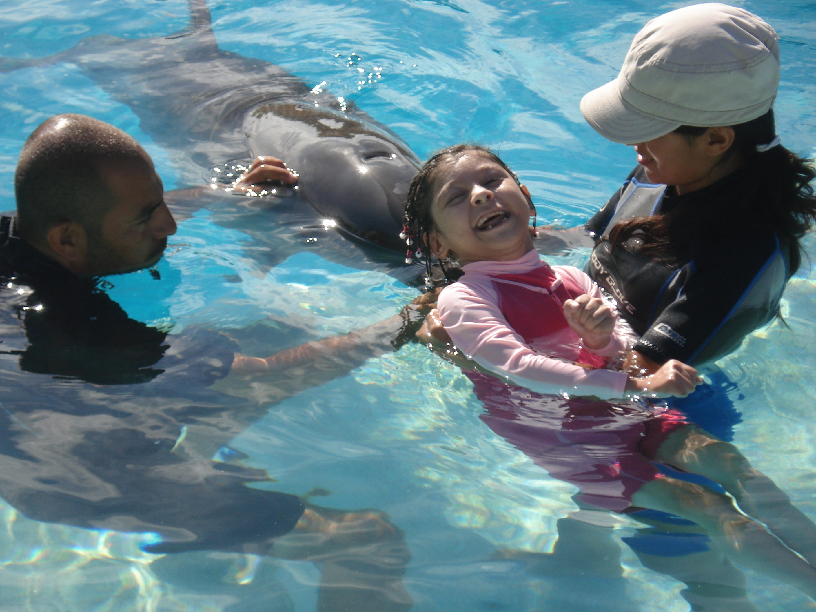 Karizma Vargas has traveled the world, including to swim with dolphins in Mexico.