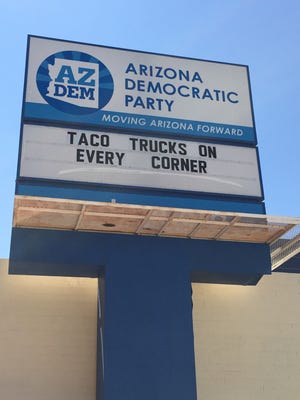The Arizona Democratic Party updated its sign on Friday