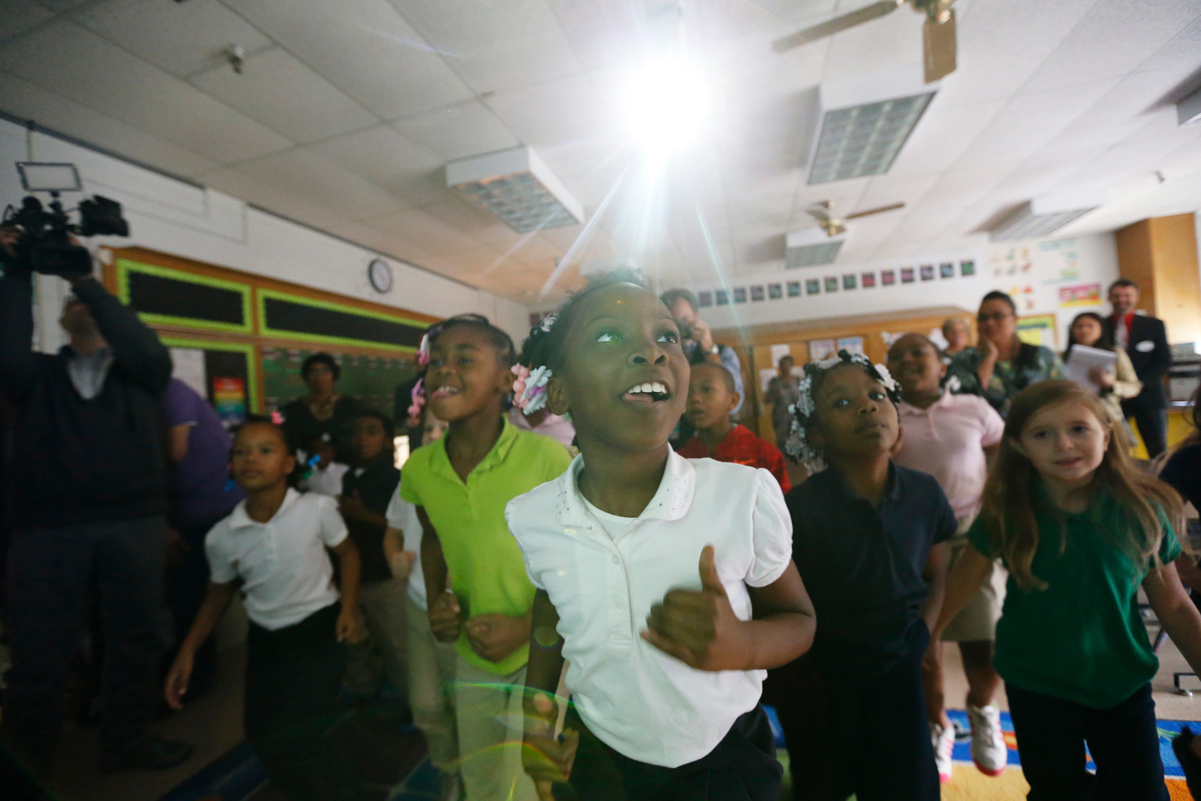 SaLiyah Knox, center, in white, and fellow second graders at Byck Elementary School danced to a video as part of the goNoodle program in Jefferson County Schools. Byck, like most elementary schools in Louisville's West End, has become increasingly segregated by race and class over the past decade.