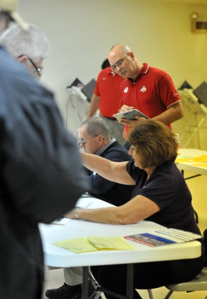 An election observer watches the voting process in Fairfield County in 2012.