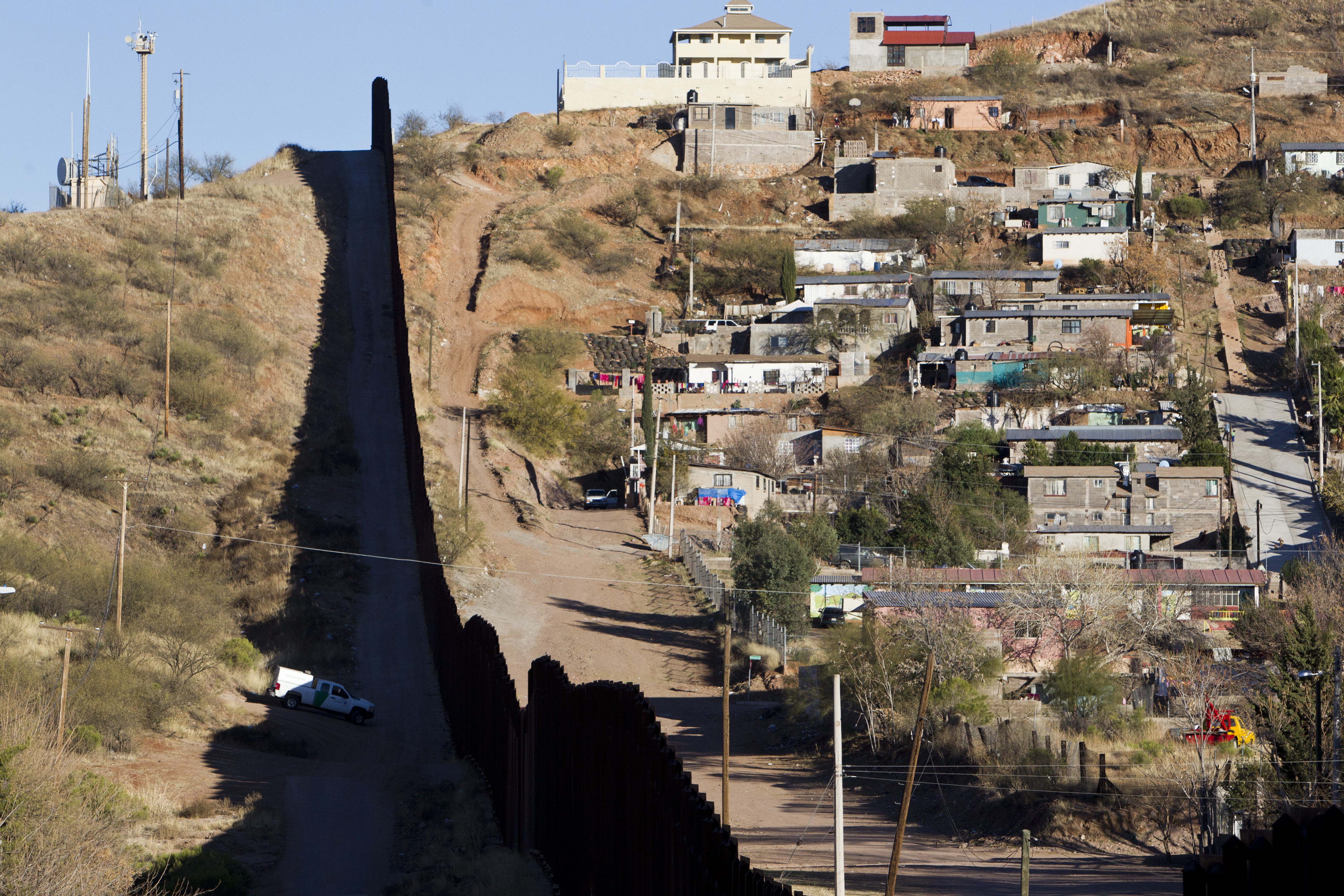 A federal judge has postponed until June 2017 the trial of a Border Patrol agent who killed a Mexican teen in Nogales. Shown is the border fence between Nogales, Arizona, and Nogales, Sonora.