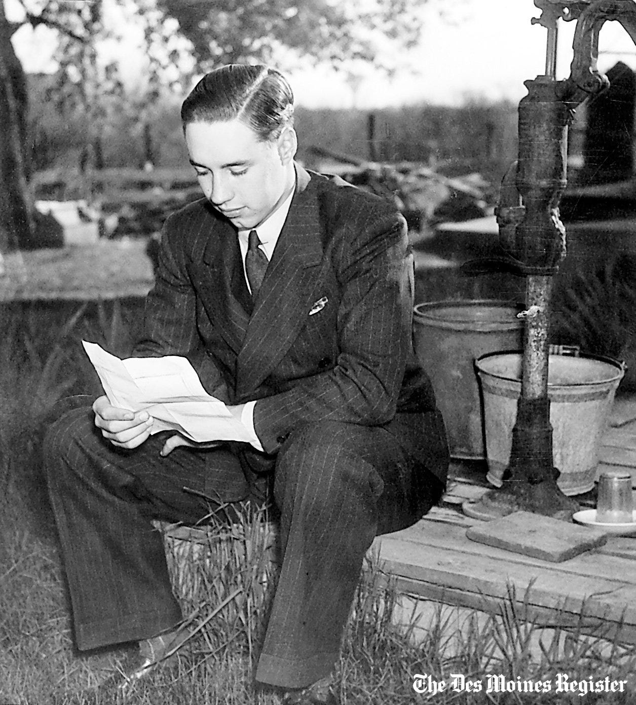 From May 1937: Bob Feller takes time out before his graduation ceremony to rehearse his speech outside his parents' home in Van Meter.