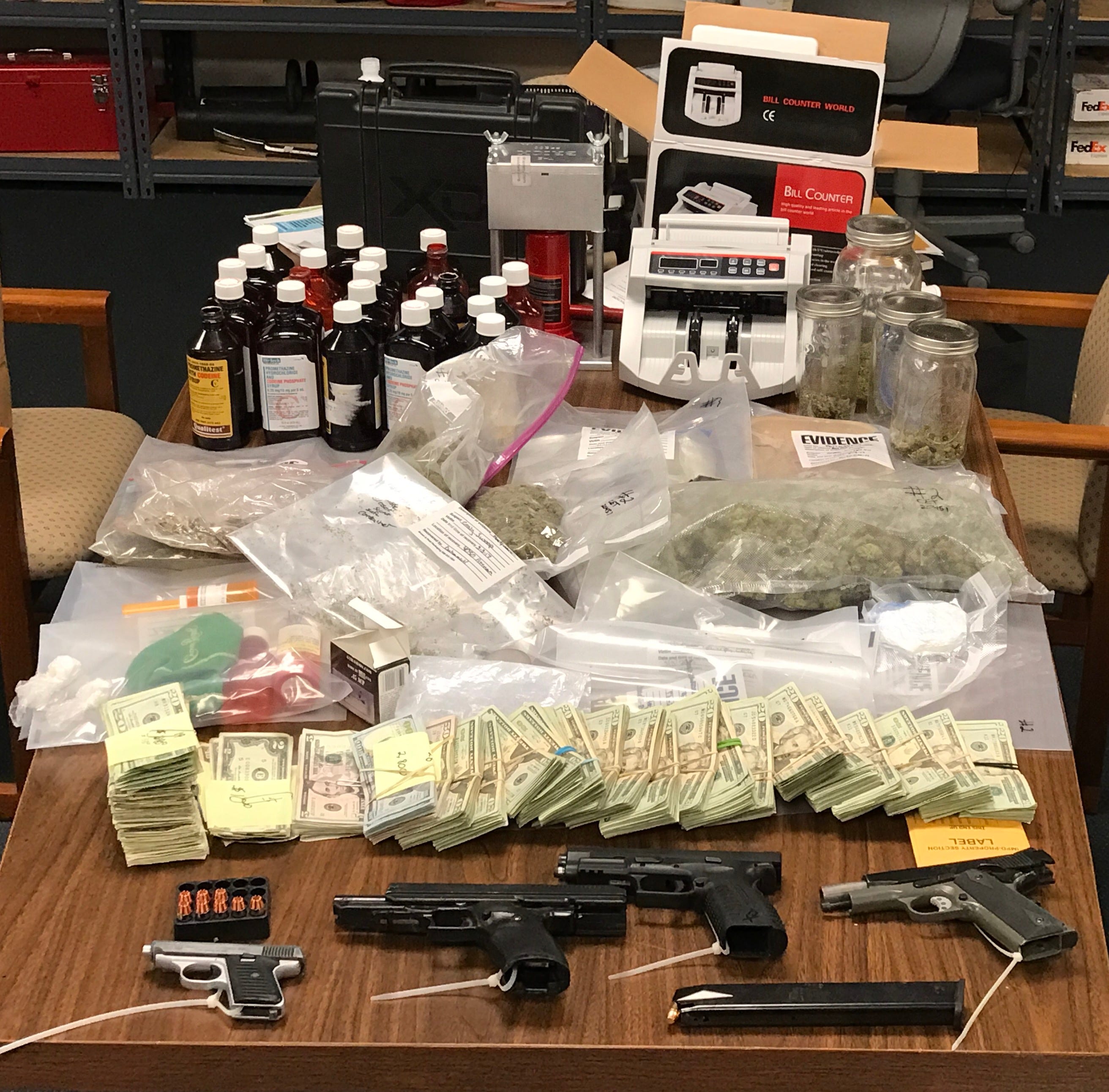 Police find assortment of drugs, handguns in house search