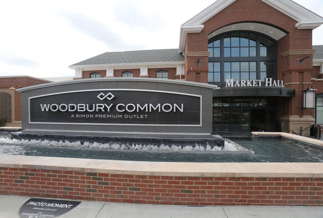 An entrance sign for Woodbury Common outside of the Market Hall in Central Valley, April 19, 2017.