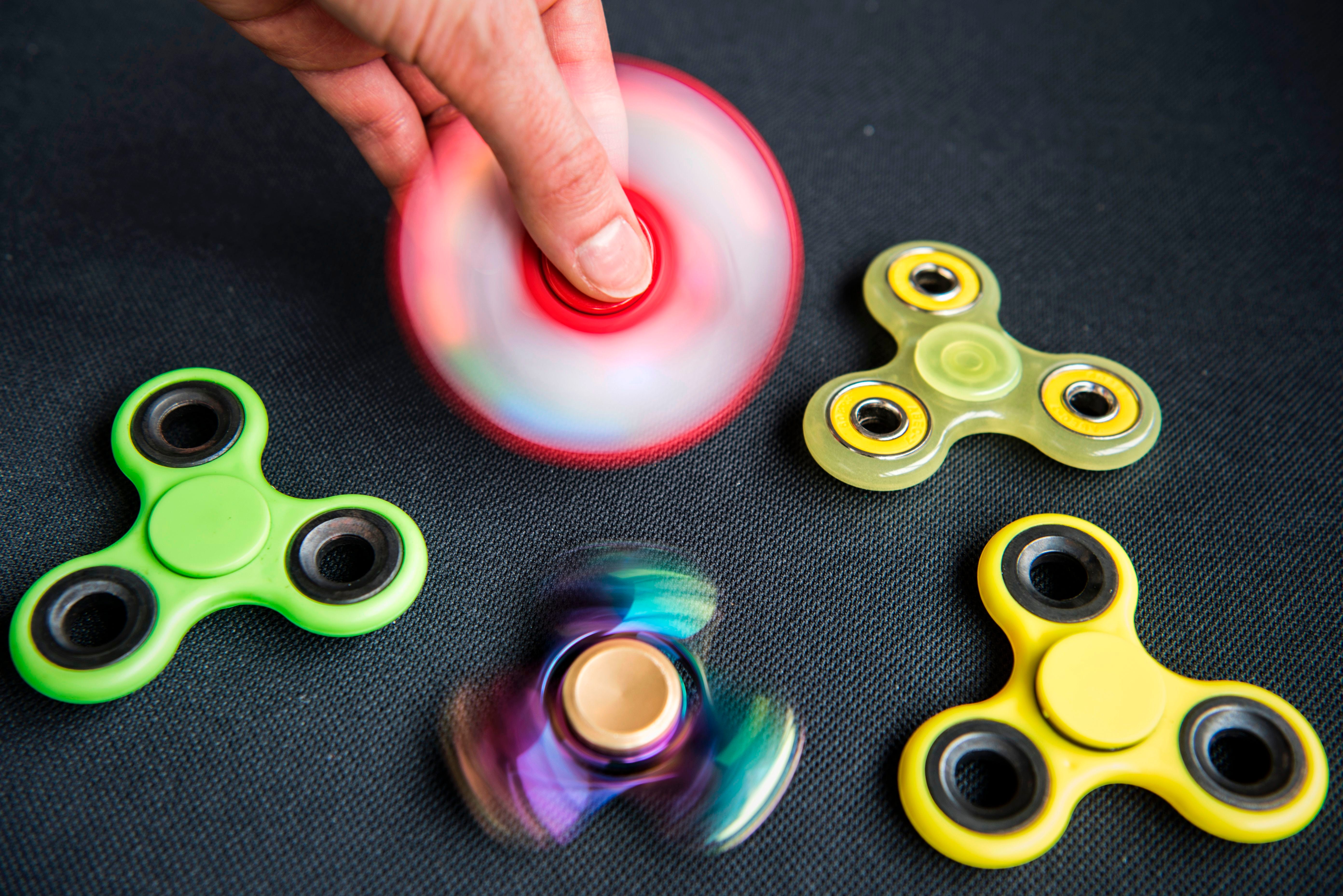 As other schools ban fidget spinners, Carmel embraces them