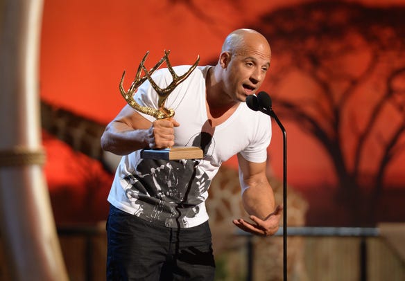 Diesel accepts the Troops Choice Entertainer of the Year award onstage during Spike TV's Guys Choice in 2013.