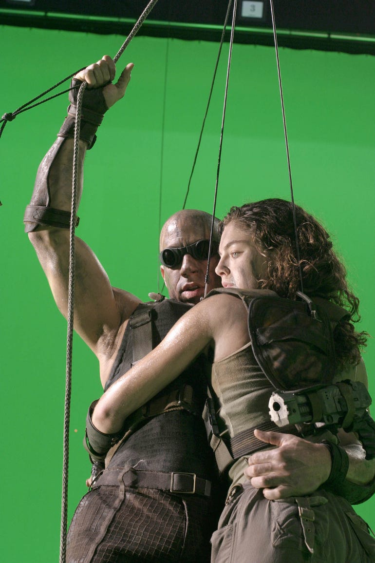 Vin Diesel and Alexa Davalos work in front of a green screen on the set of "The Chronicles of Riddick."