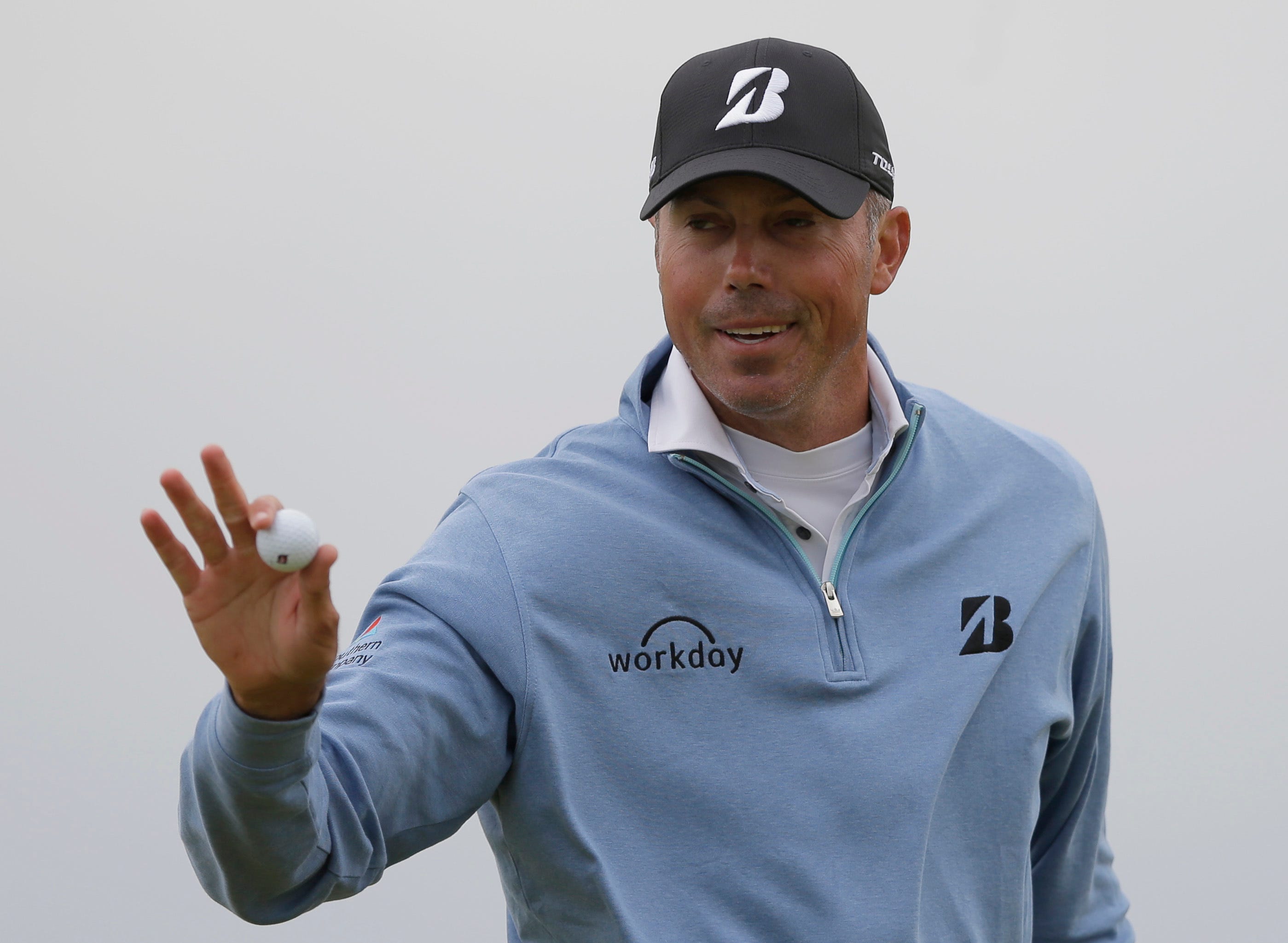 The Latest: Kuchar gets out of the wind and posts a target