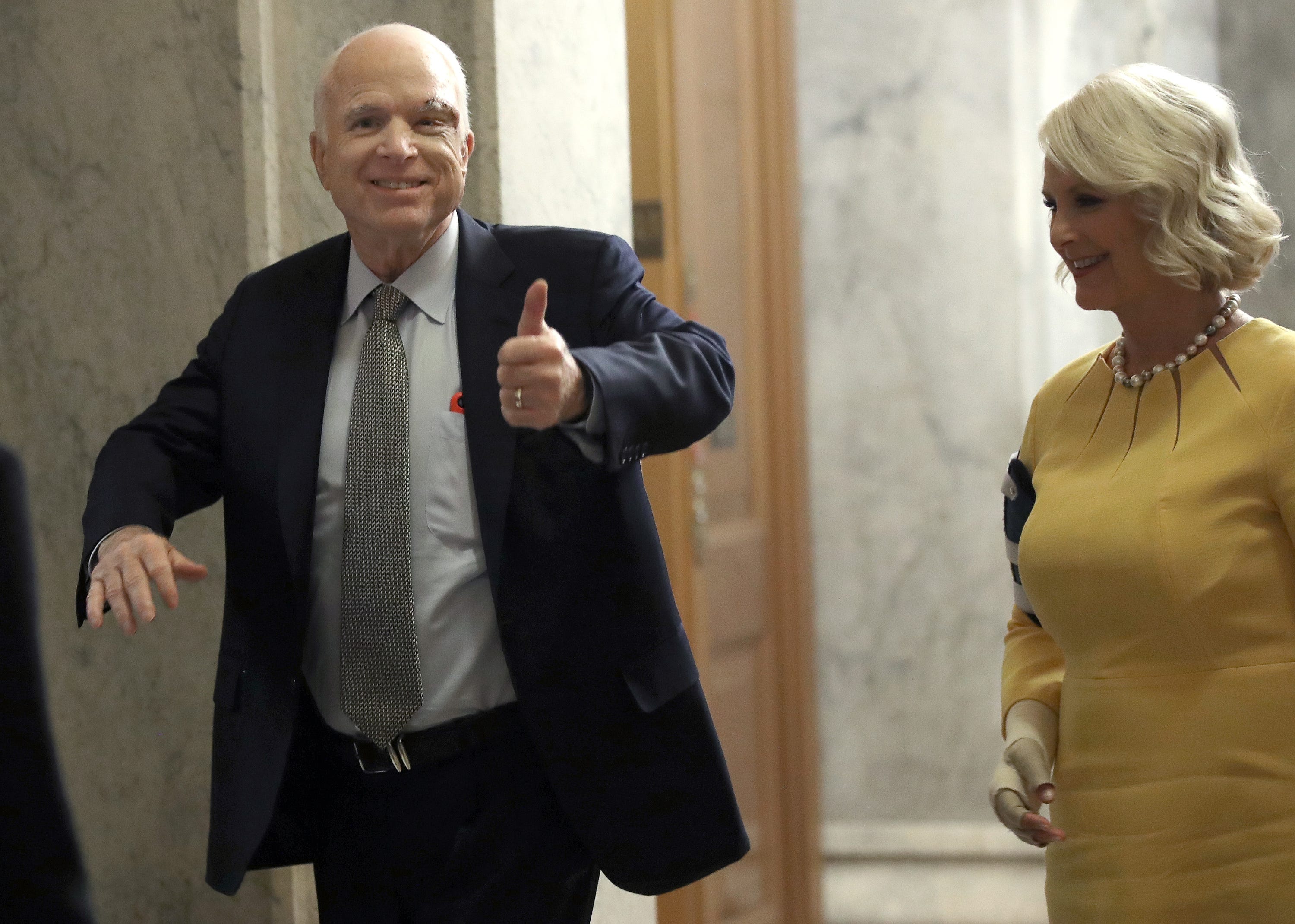 McCain, battling cancer, returns to Senate and casts critical health care vote