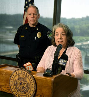 Mayor Madeline Rogero, with Police Chief David Rausch, addresses removal of a Bible verse at KPD Safety Building on July 26.