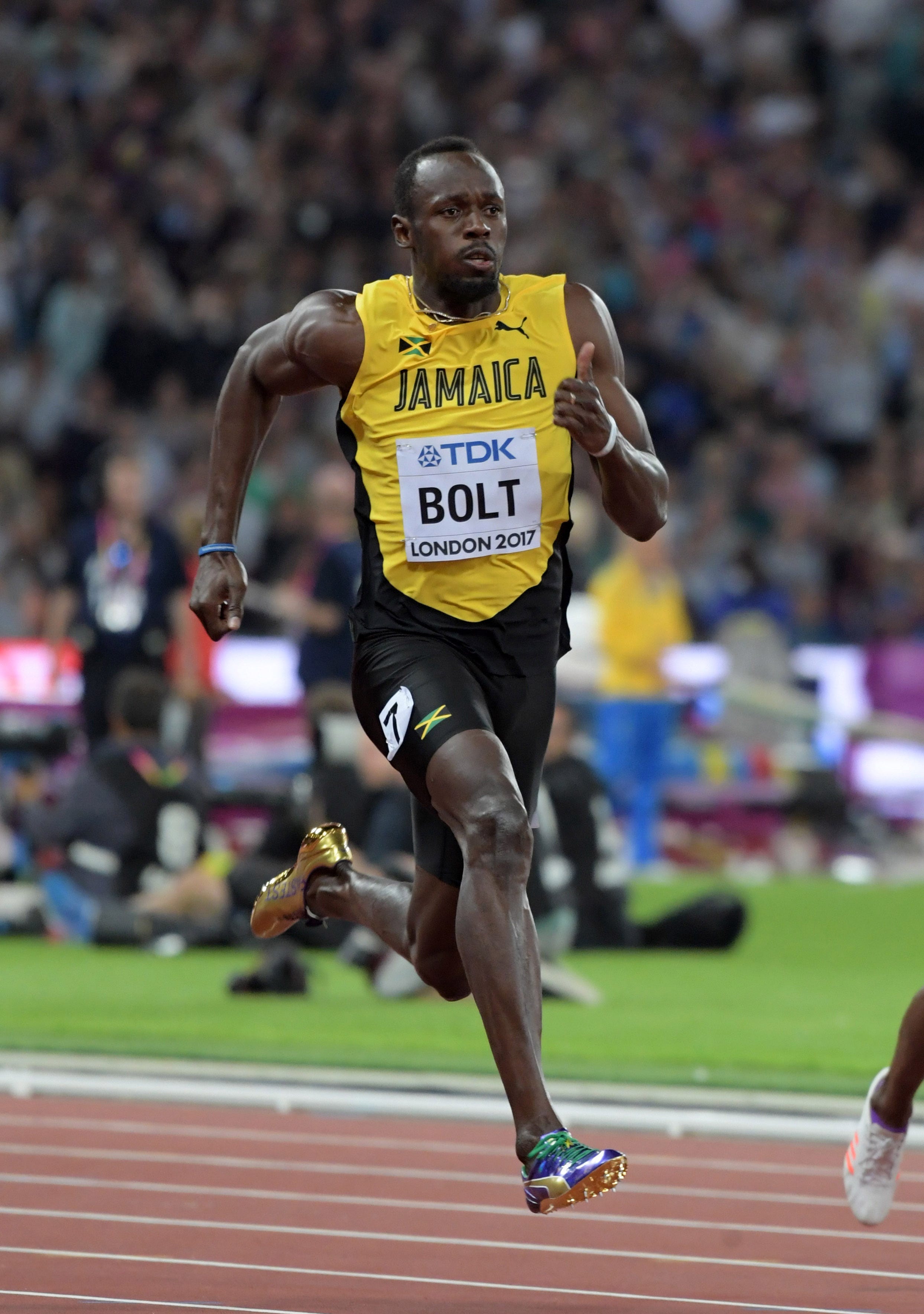 Stunner: Usain Bolt finishes third in the 100 in his final championships Stunner: Usain Bolt finishes third in the 100 in his final championships