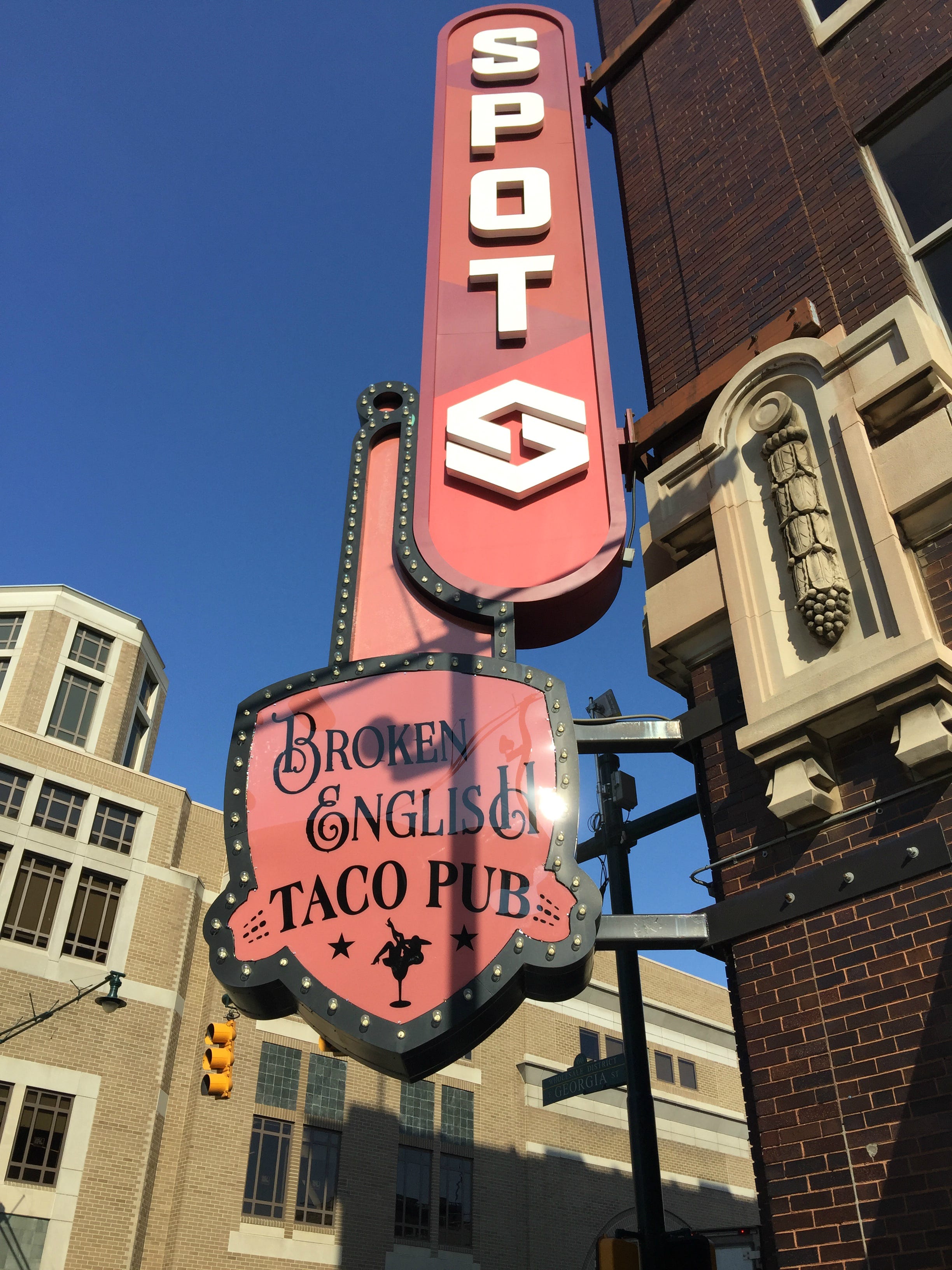 Why is the new taco bar opening Downtown called 'Broken English'?