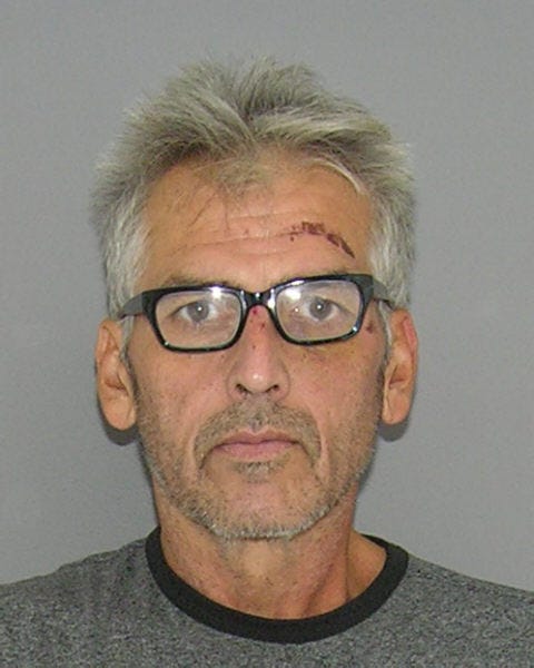 Police subdue naked attacker armed with tomahawk and bayonet