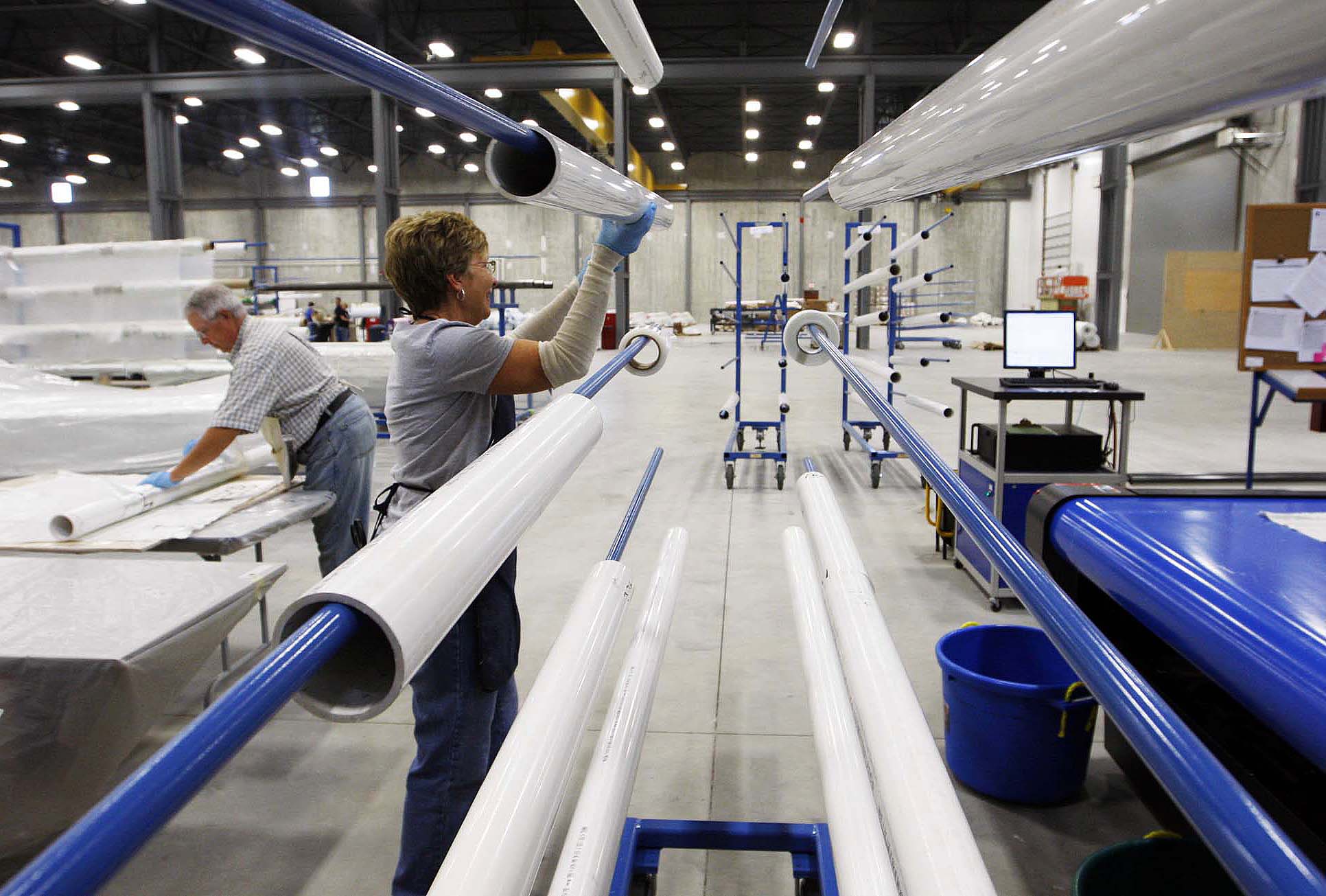 Pipe used to roll fiberglass is placed on a holder inside the TPI Composites wind turbine fabrication plant in Newton, Iowa. The wind energy industry replaced some of the jobs lost when Maytag left town.