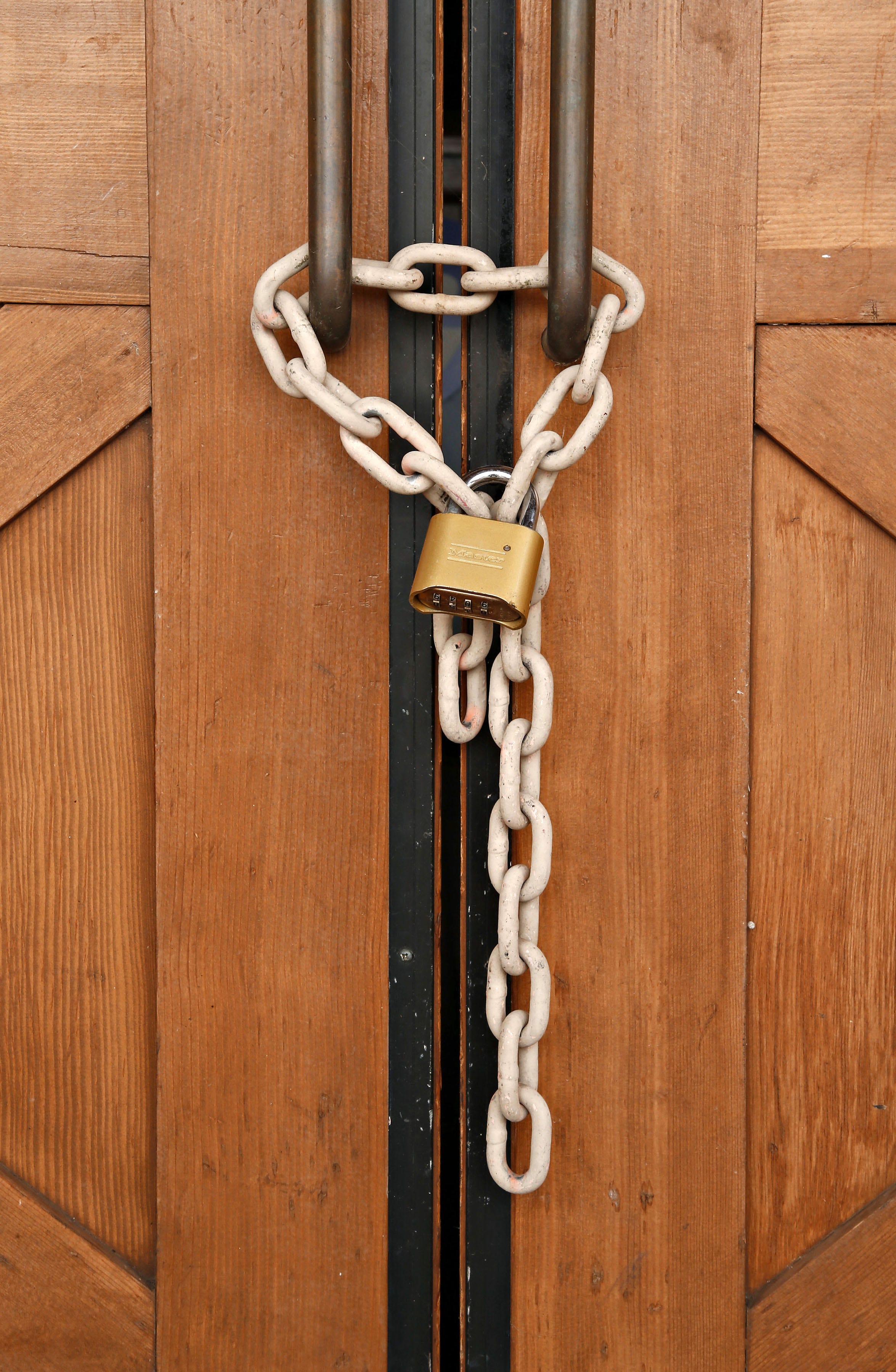 In this September 2015 photo, a chain and a lock secure the doors of a long-shuttered Toby Keith's I Love This Bar and Grill in Mesa.