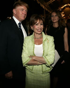 Donald Trump poses with Jeanine Pirro as they enter the gala opening of Trump Towers at City Center Sept. 21, 2005 in White Plains. Melania Trump, at right looks on.