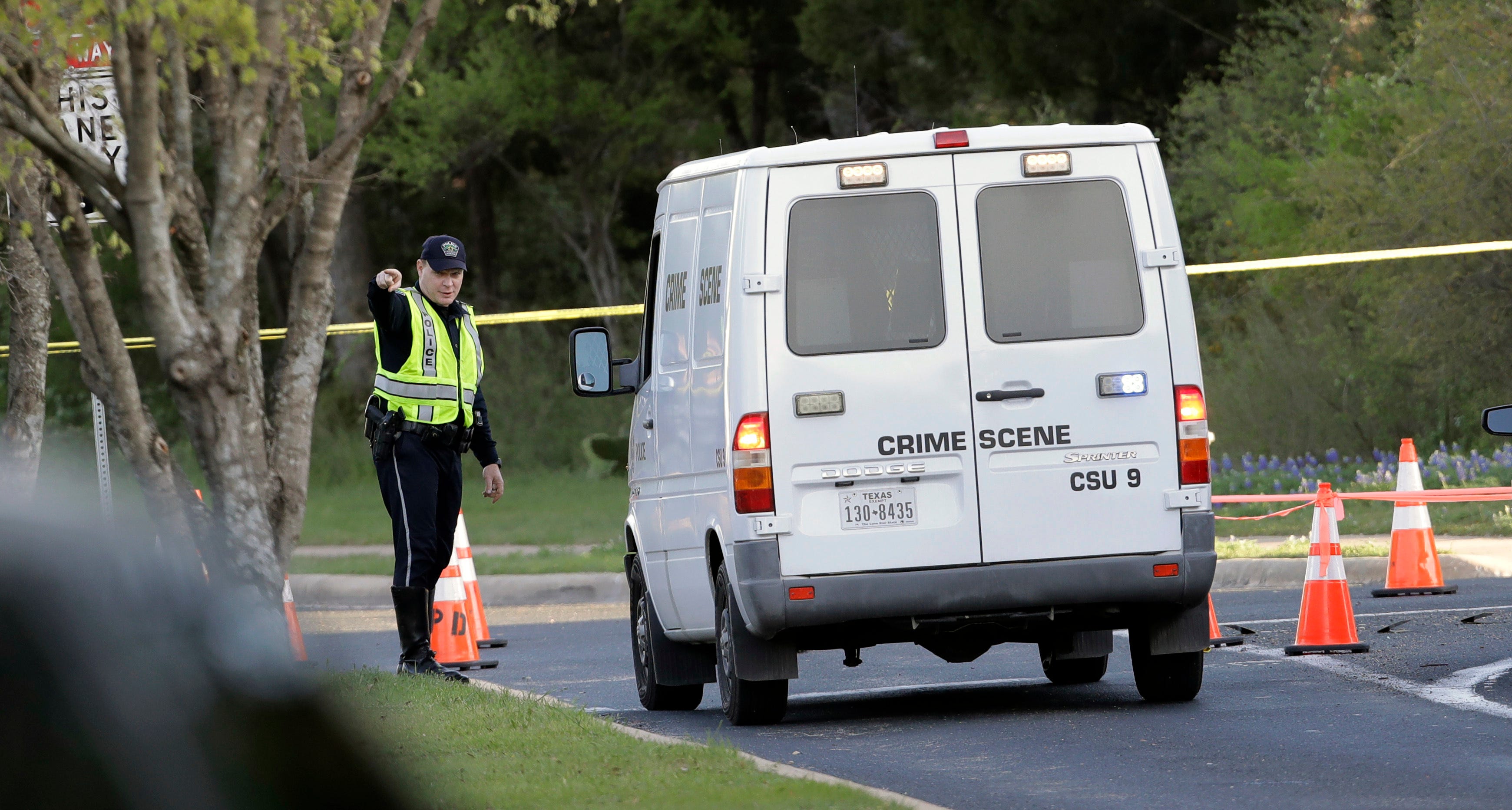 A police crime scene van arrives near the site of Sunday's deadly explosion, March 19, 2018, in Austin, Texas. Police warned nearby residents to remain indoors overnight as investigators looked for possible links to other package bombings elsewhere i