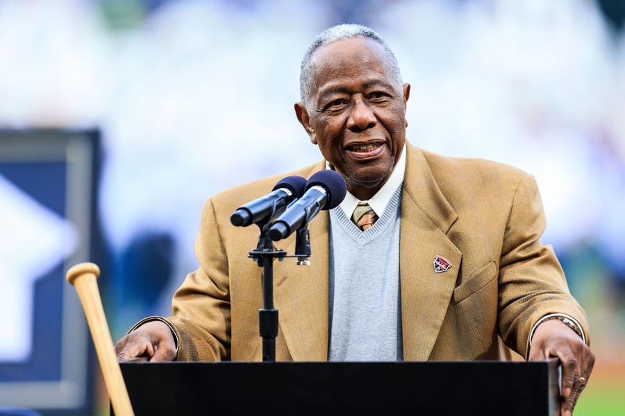 Former Braves slugger Hank Aaron speaks during a 2014 ceremony at Turner Field in Atlanta celebrating the 40th anniversary of his record-breaking 715th home run.