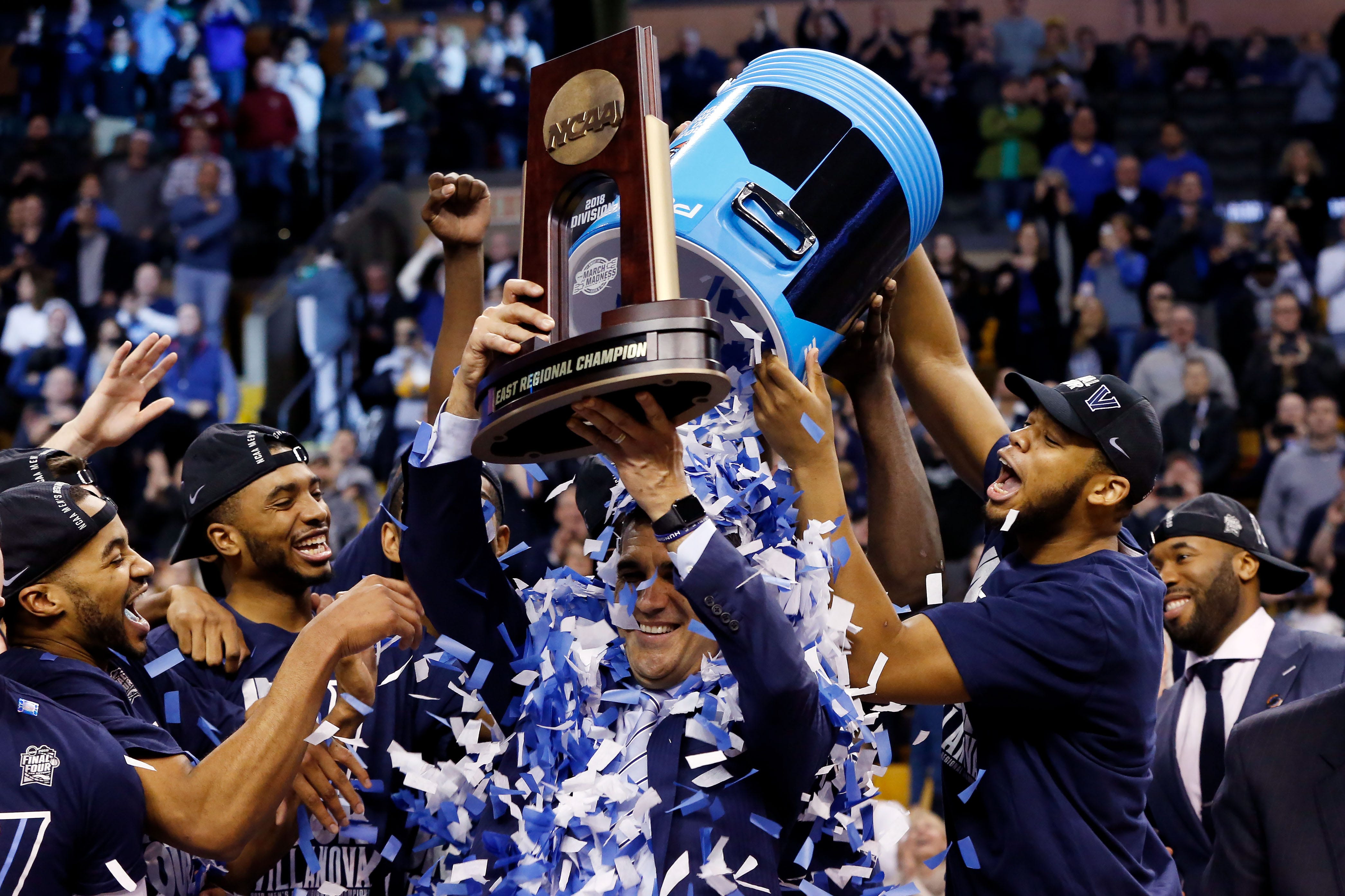 The Villanova Wildcats dump confetti on head coach Jay Wright after defeating the Texas Tech Red Raiders in the championship game of the East regional of the 2018 NCAA Tournament at the TD Garden in Boston.