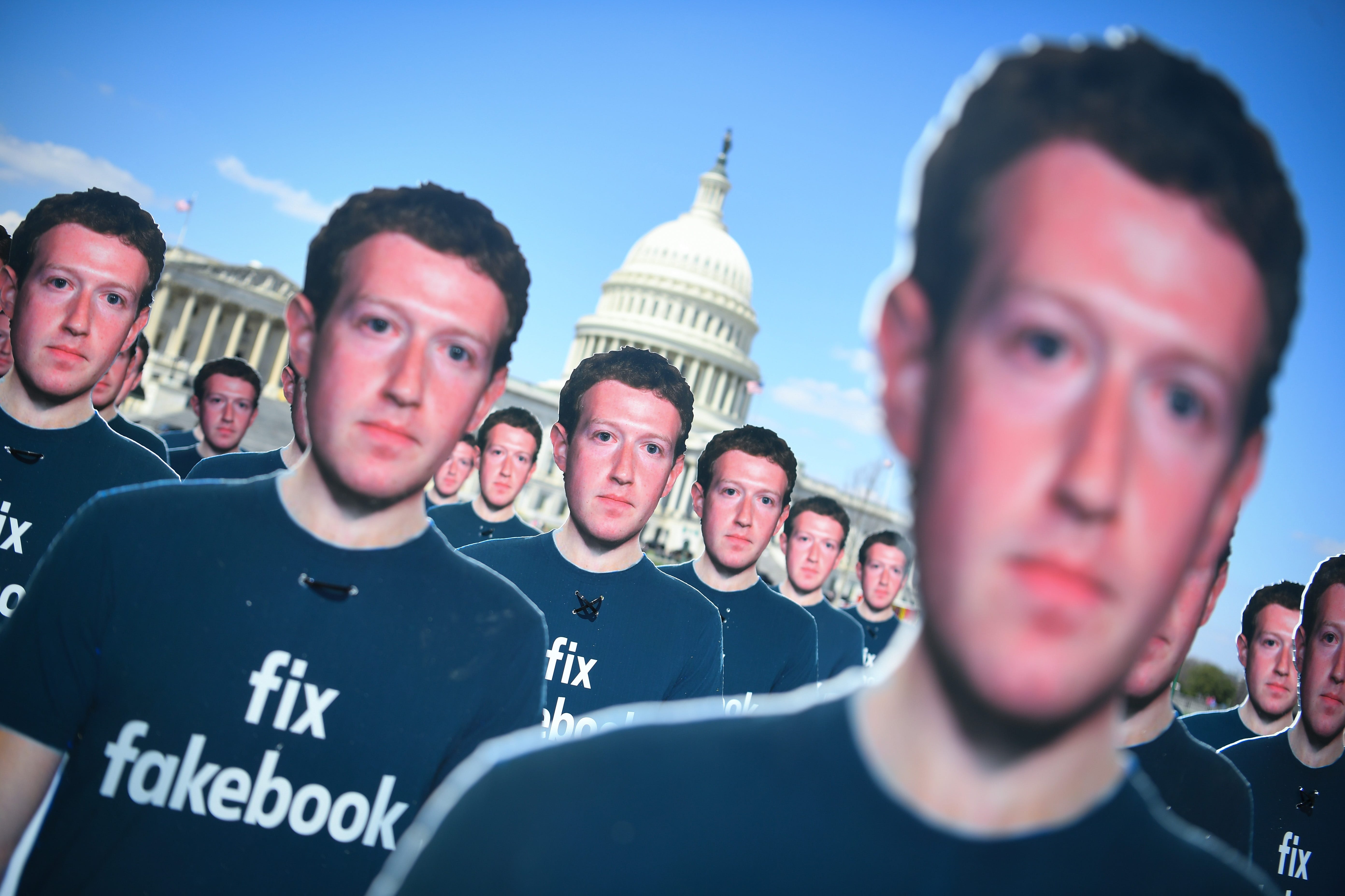 Life-sized cutouts of Facebook CEO Mark Zuckerberg are placed by the advocacy group Avaaz on the lawn of the United States Capitol in Washington on April 10, 2018, ahead of ZuckerbergÃ•s appearance before a joint hearing of the Senate Judiciary Commi