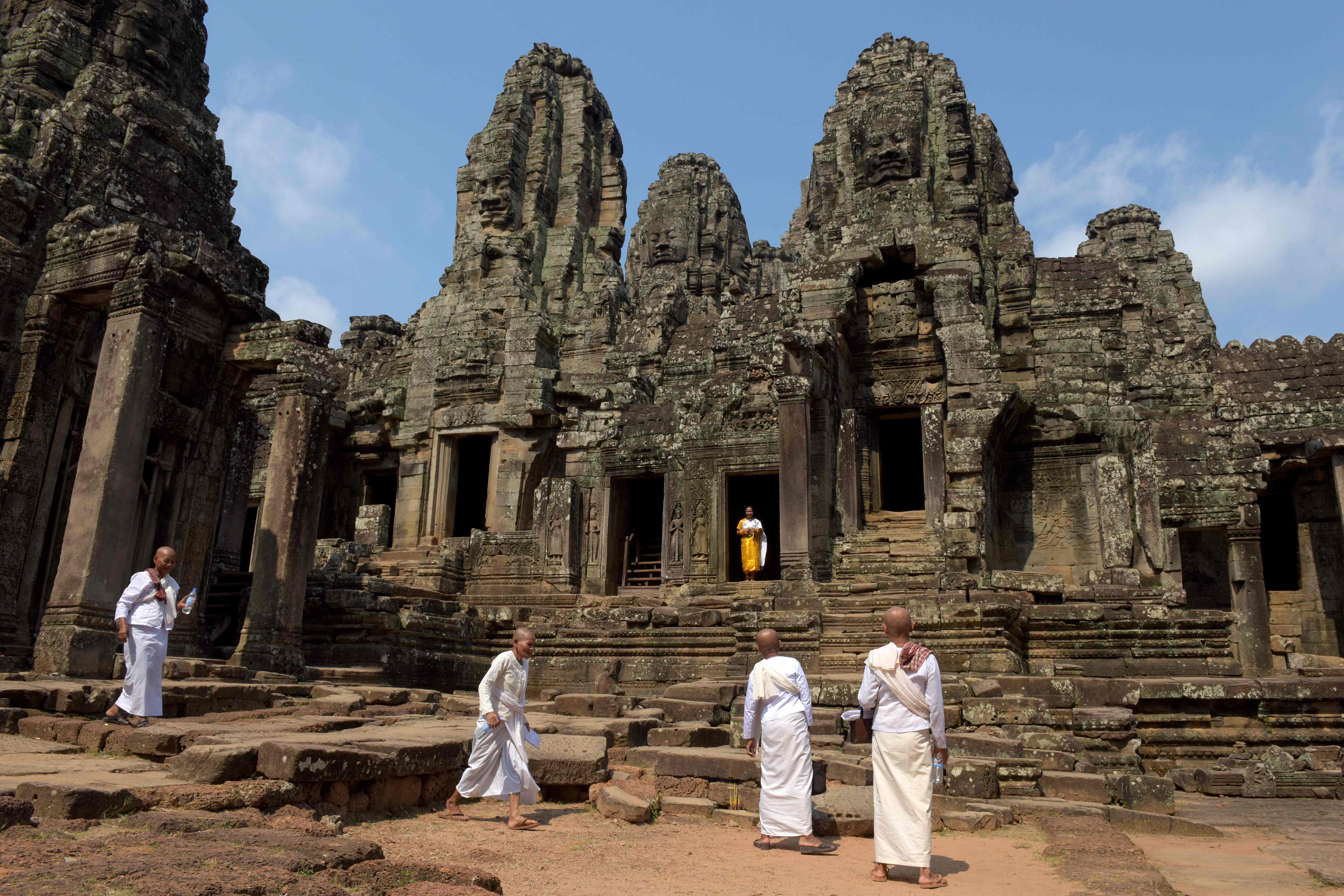 Cambodian nuns walk during Khmer New Year at Bayon temple in the Angkor complex in Siem Reap province on April 14, 2018.