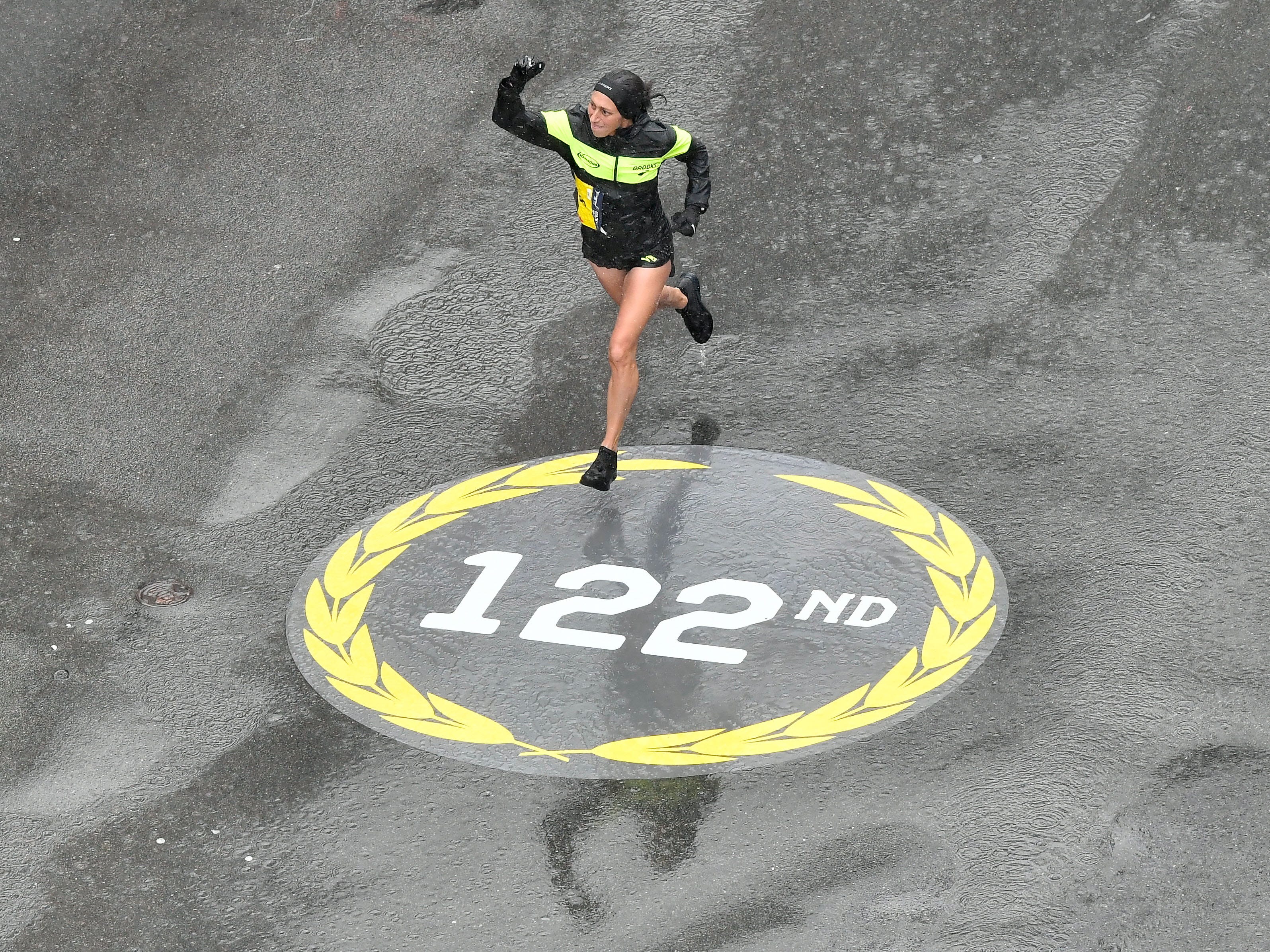 Desiree Linden runs down Boylston Street towards the finish line of the 2018 Boston Marathon.