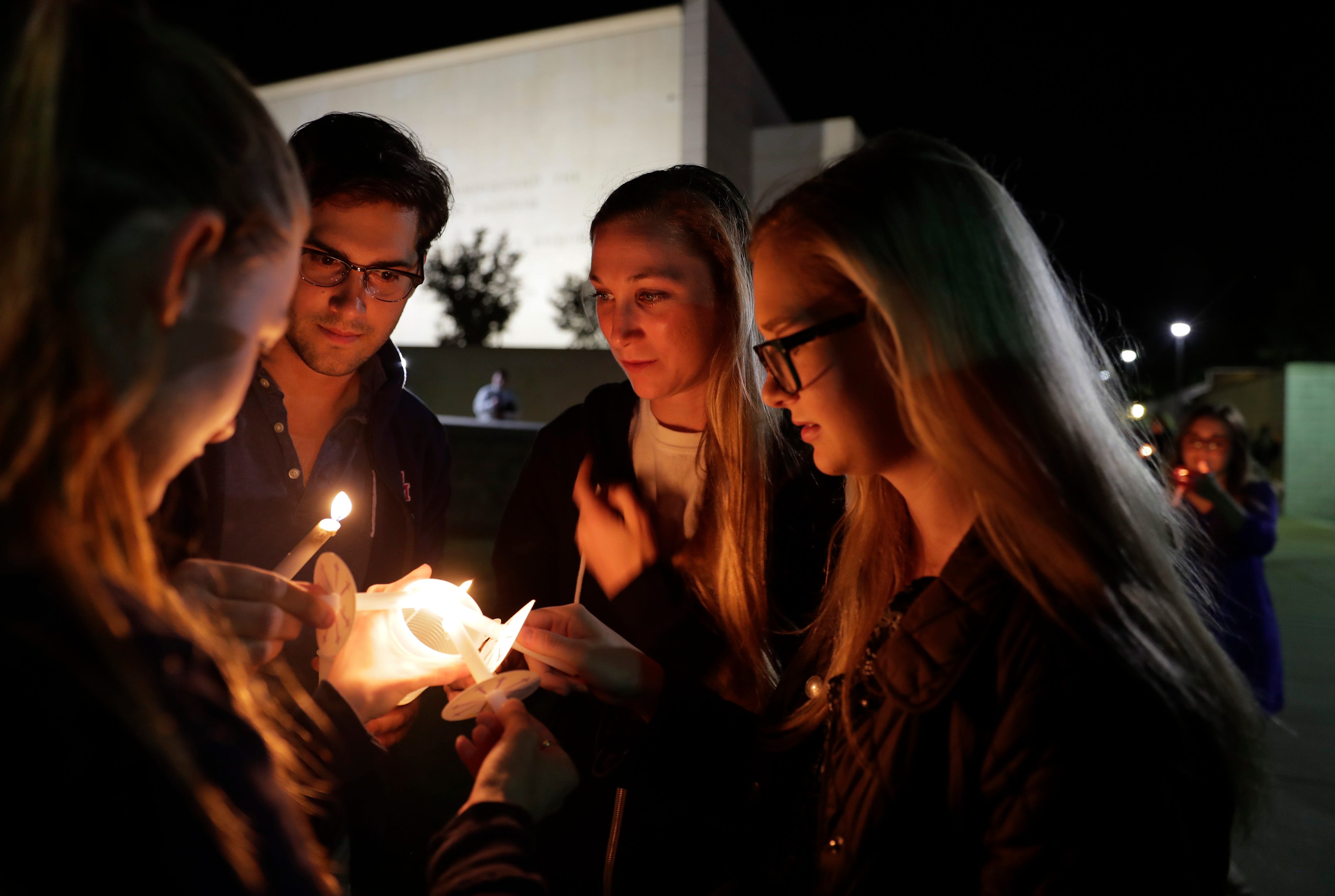 Texas A&M students gather for a candlelight vigil and memorial behind the George Bush Presidential Library & Museum in College Station, Texas on April 17, 2018 to remember former First Lady Barbara Bush who passed away earlier in the day.